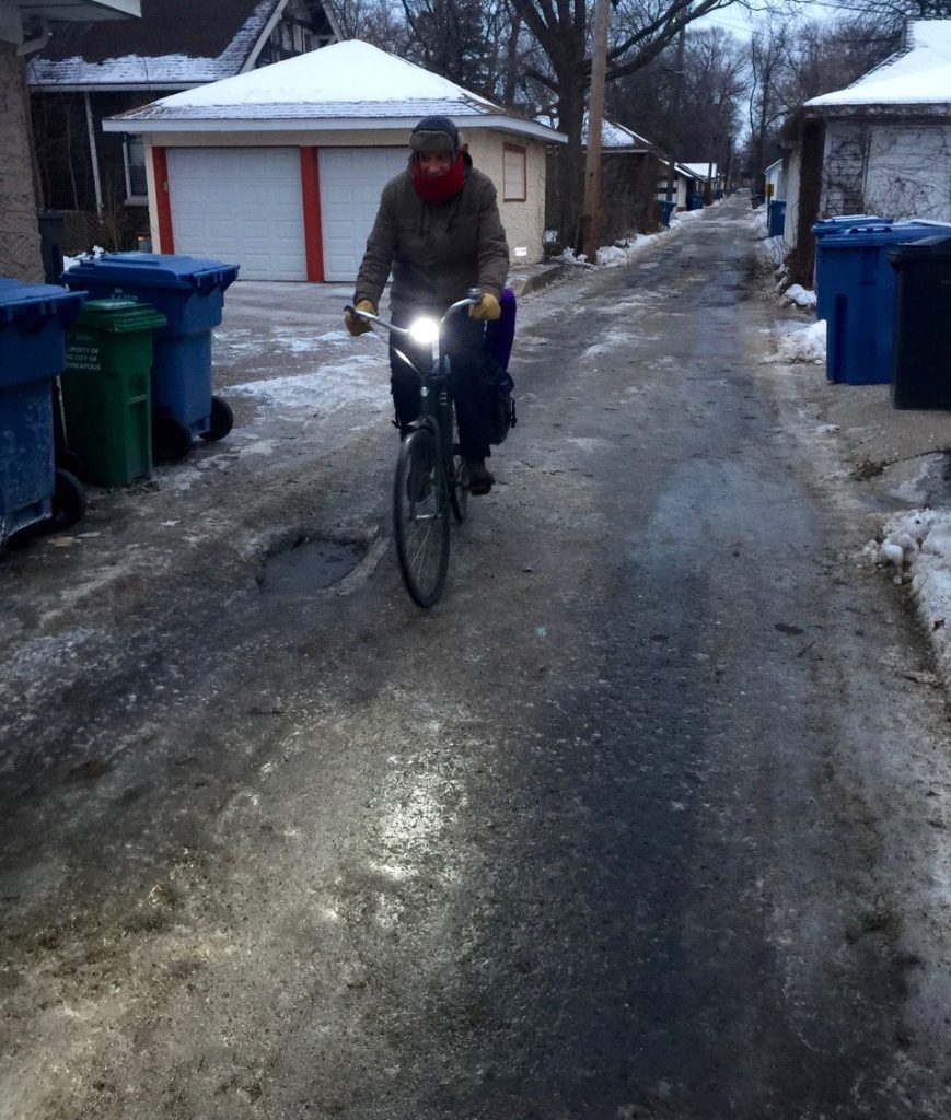 Jim Ruiz breezes down "Ice Alley" with extra bright headlight and studded tires